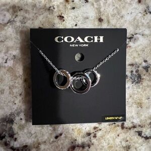Silver coach necklace